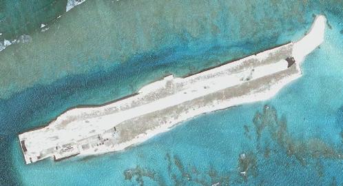 An airstrip on a corral reef west-northwest of Hawaii.